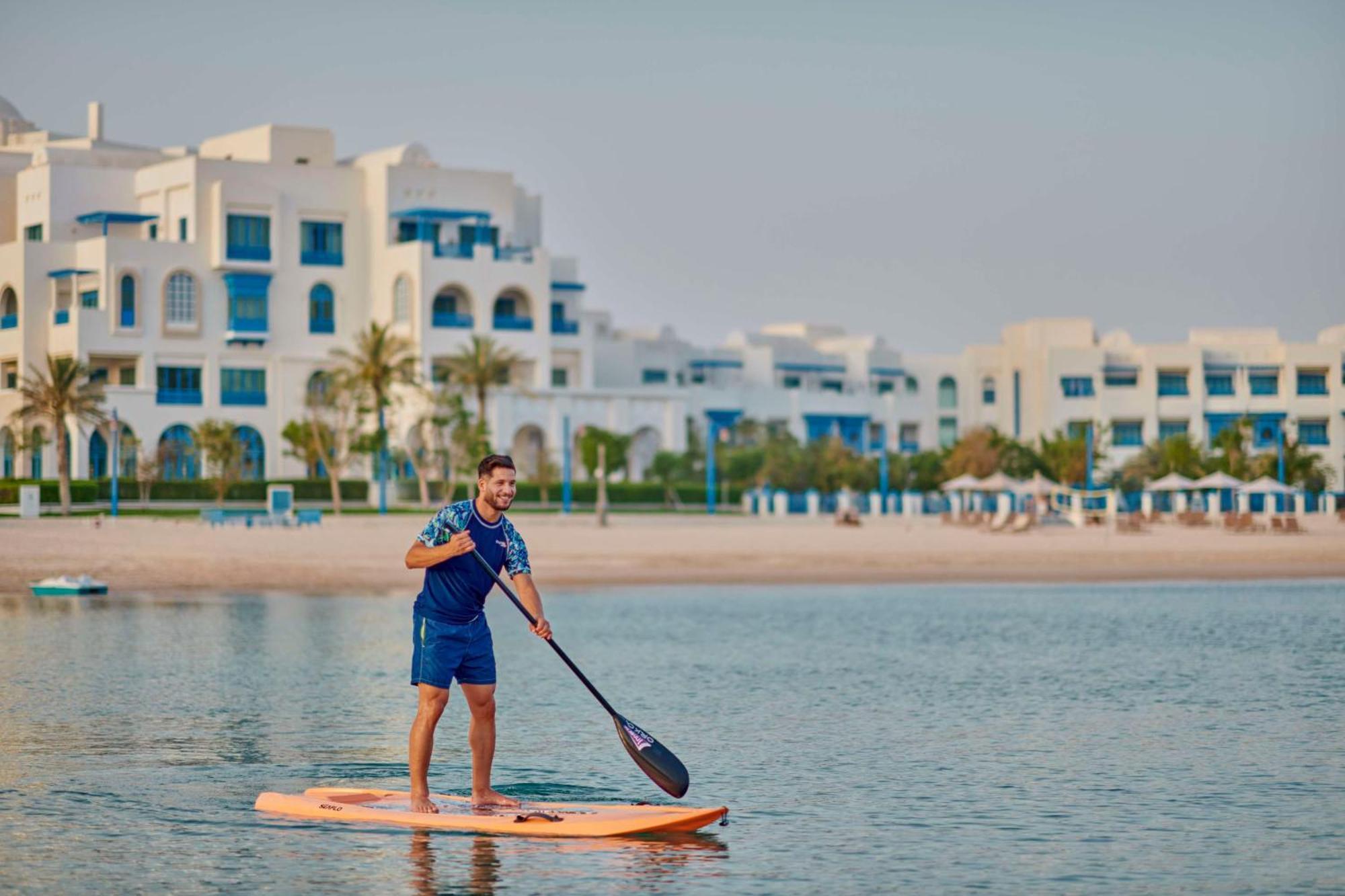 Hilton Salwa Beach Resort And Villas Abu Samra Bagian luar foto Stand Up Paddle Boarding at Al Habtoor Polo & Equestrian Club
